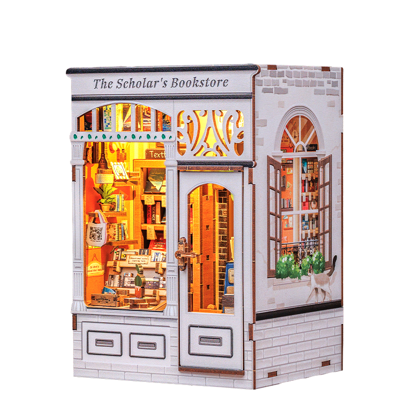 Model of a bookstore with illuminated interior, featuring 'CuteBee' branding.