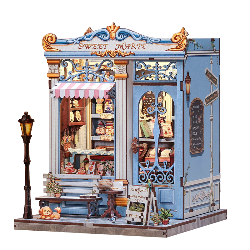 Decorative model of a sweet shop with intricate details and 'Cute Bee' branding.